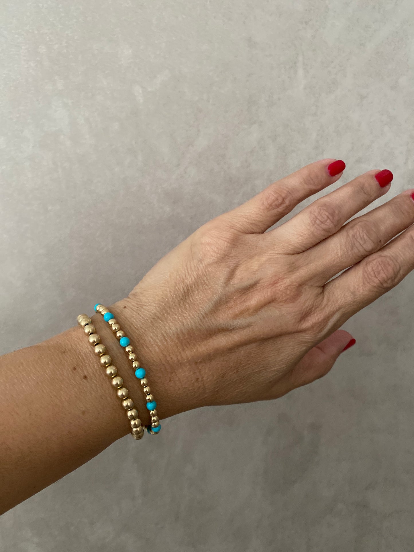 The Capri gold ball stacking stretch bracelets in 14KT Gold filled