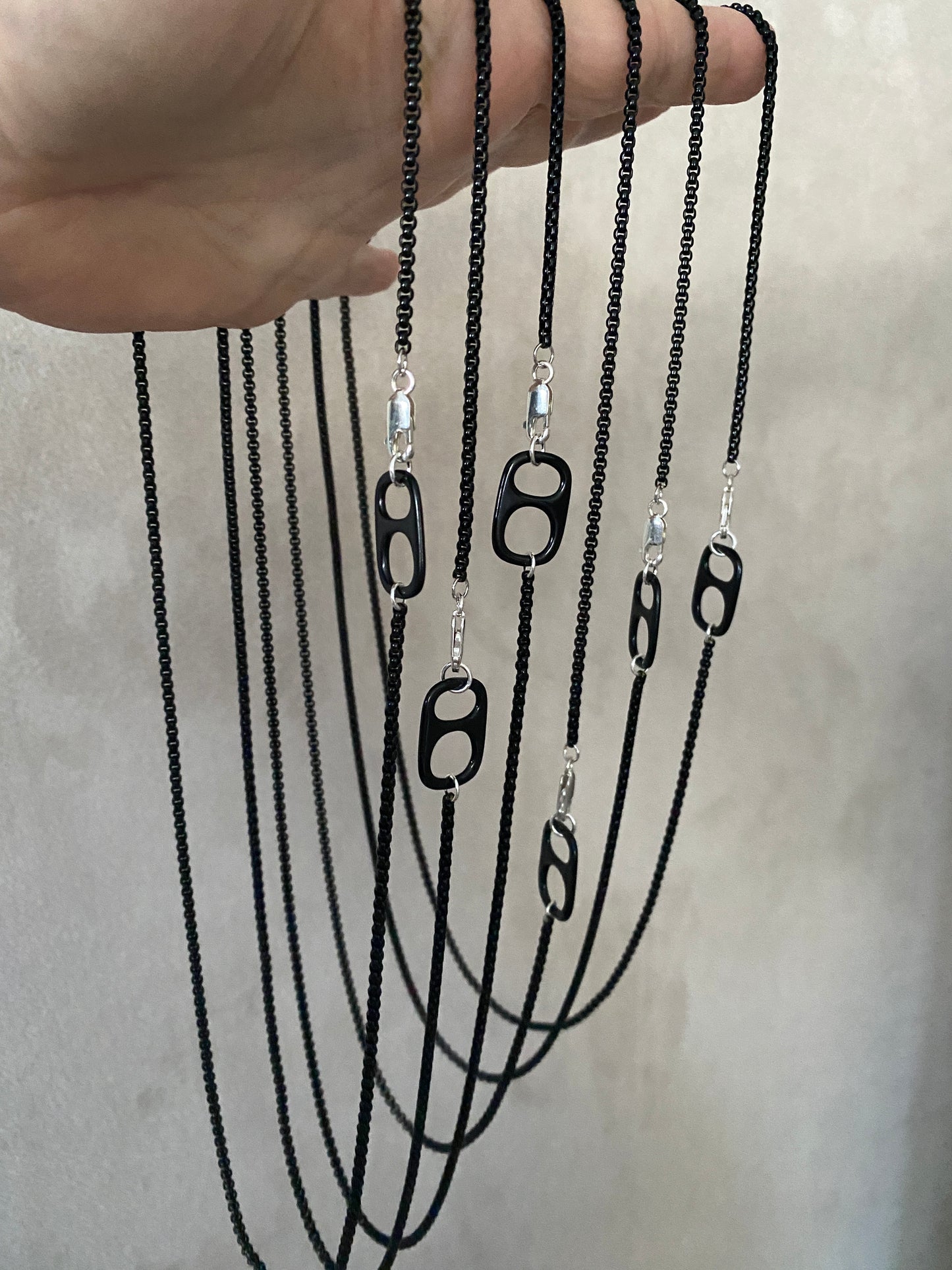The Tab necklace in black enamel box chain.