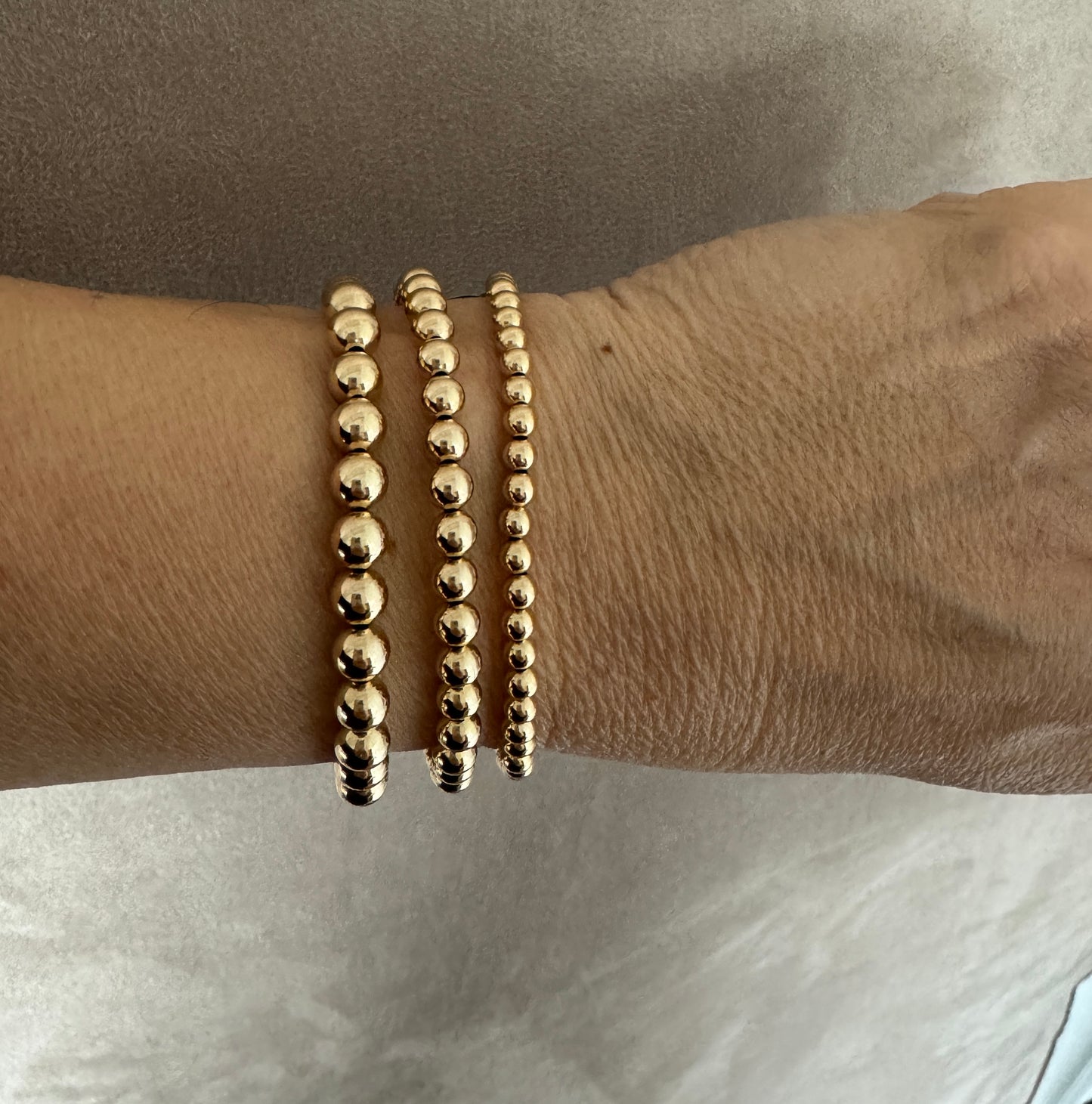 The Capri gold ball stacking stretch bracelets in 14KT Gold filled