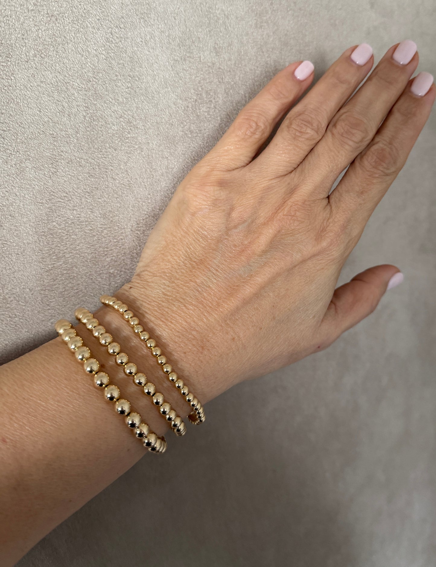 The Capri gold ball stacking stretch bracelets in 14KT Gold filled