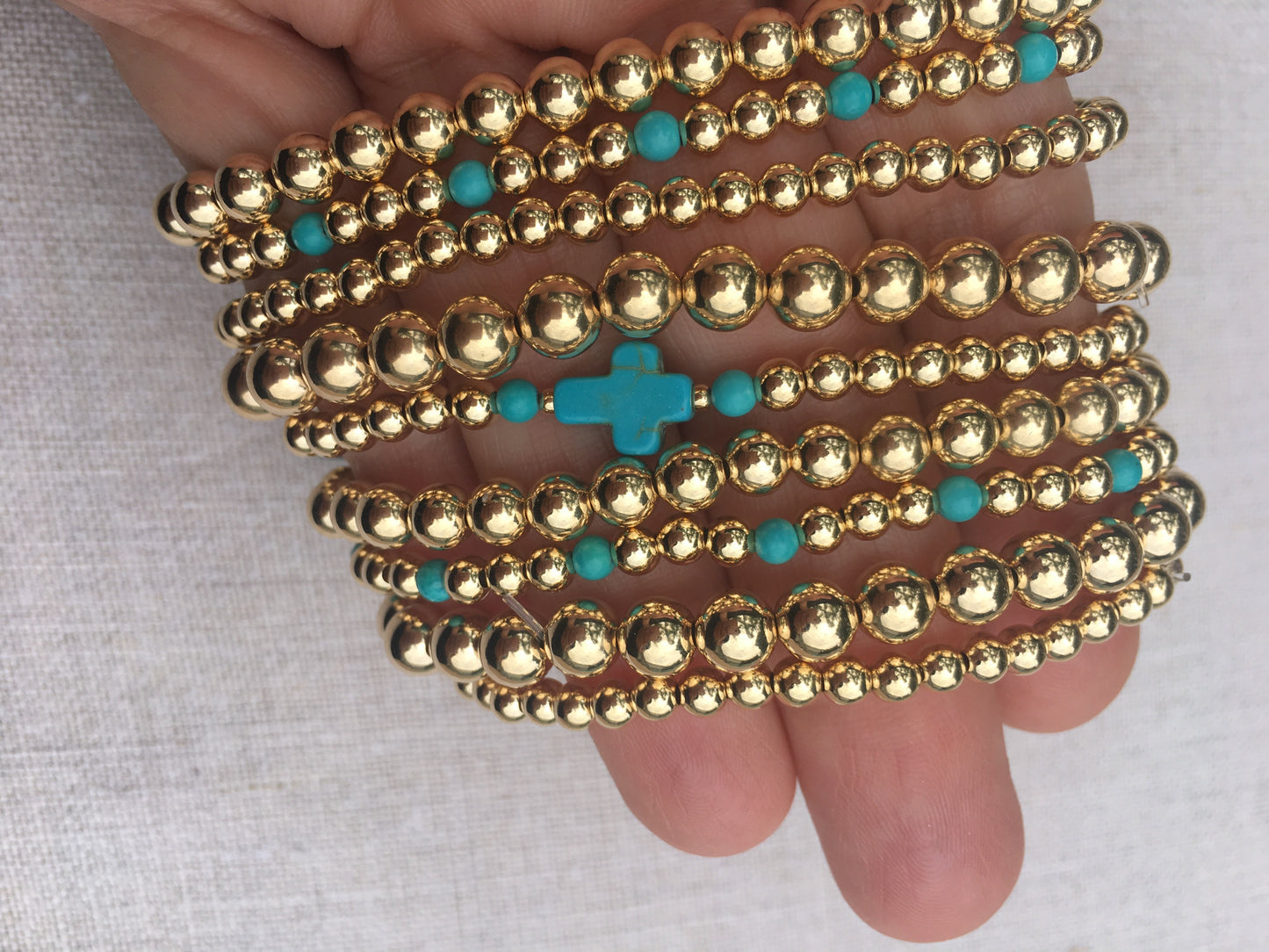 The Capri gold ball stacking stretch bracelets in 14KT Gold filled