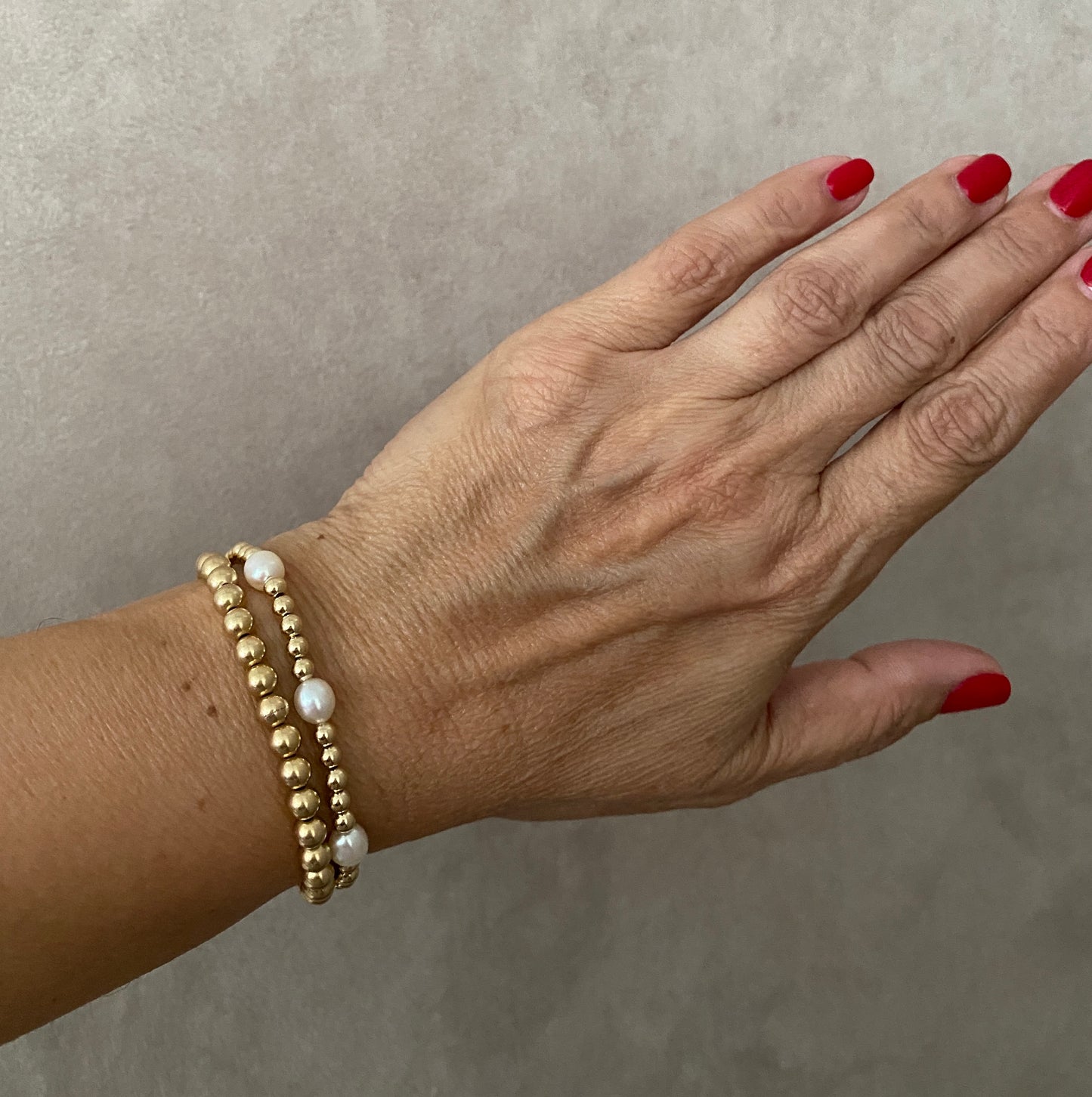 The Capri gold ball stacking stretch bracelets in 14KT Gold filled