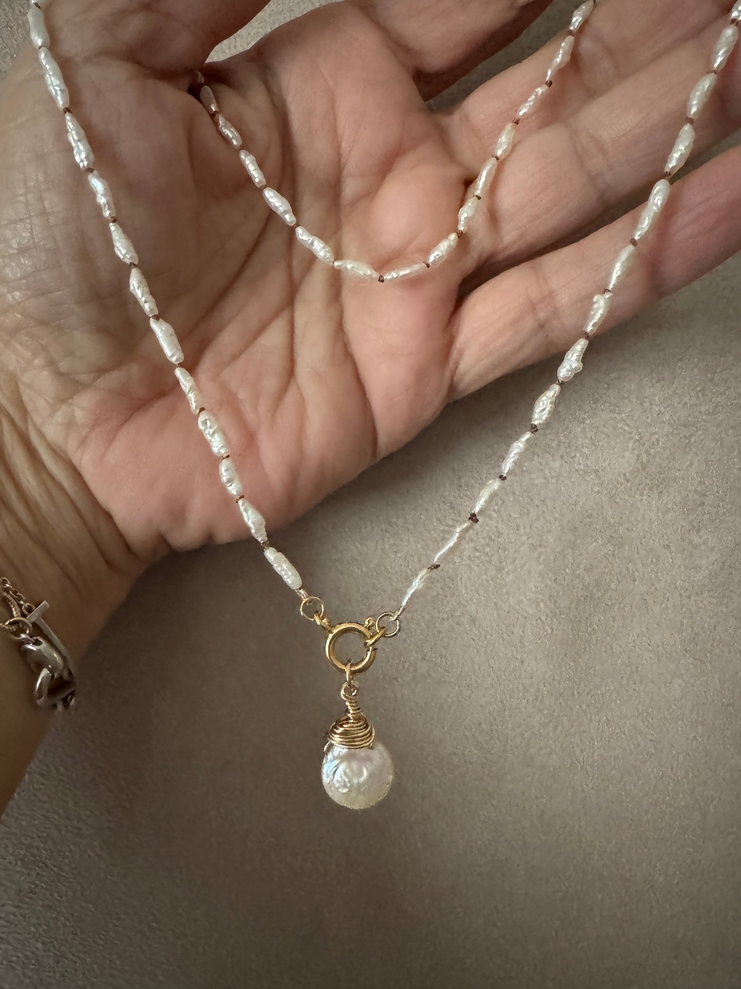 The Hana necklace in vintage Japanese pearls.