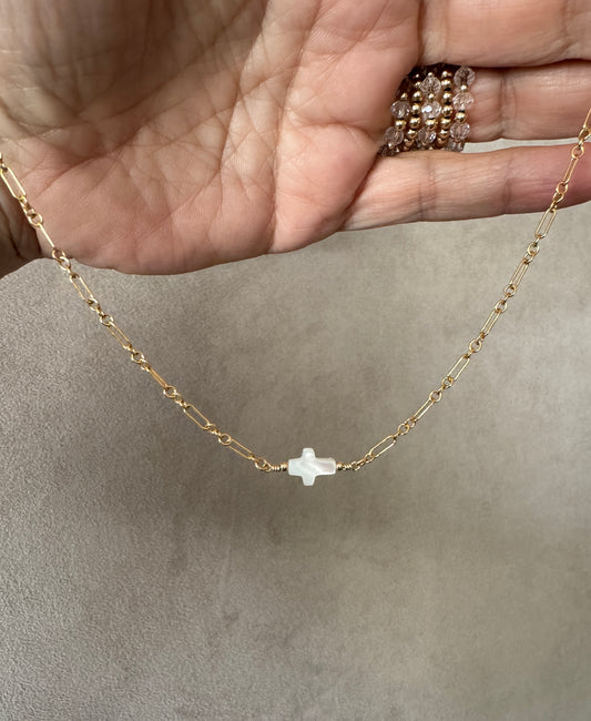 The Amelia Mother of Pearl cross necklace in 14KT Gold filled.