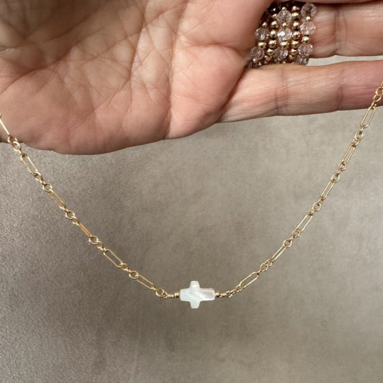The Amelia Mother of Pearl cross necklace in 14KT Gold filled.