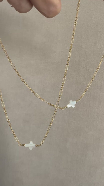 The Amelia Mother of Pearl cross necklace in 14KT Gold filled.